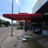 Ô kéo đỏ ຮົ່ມຄັນໂຍກສີແດງ